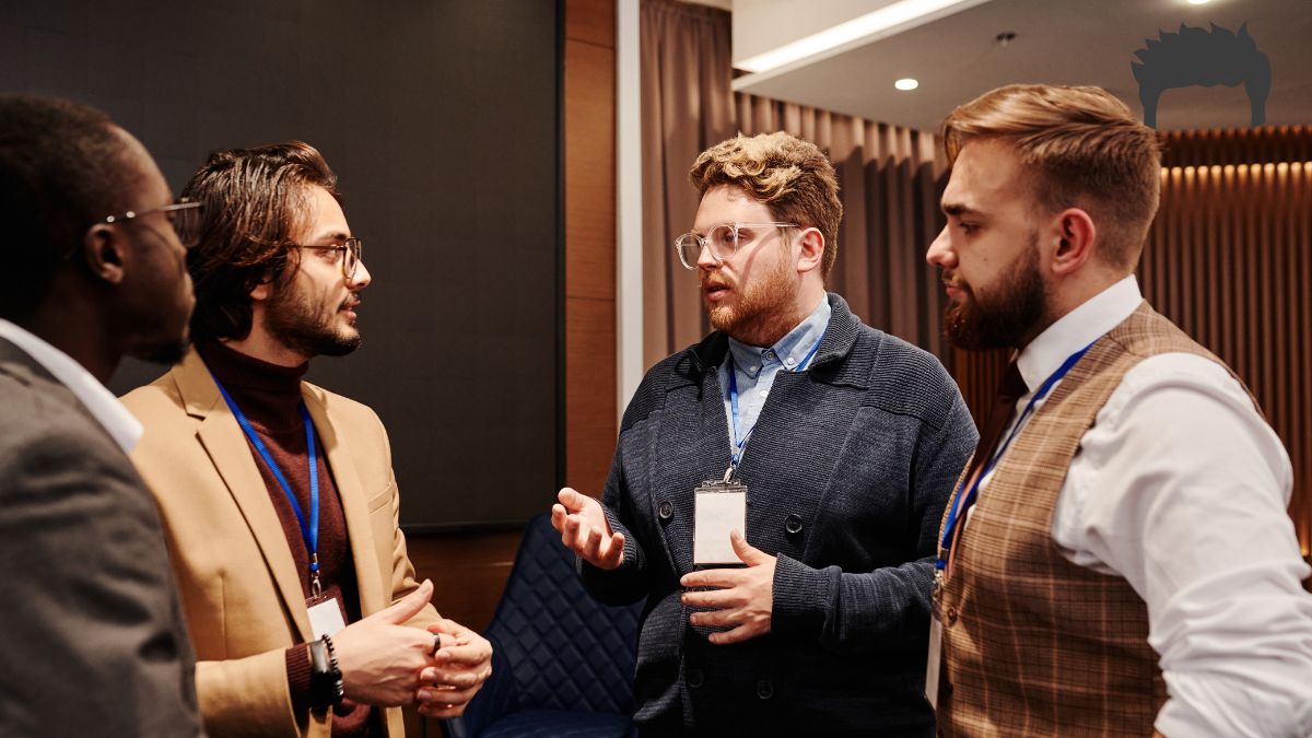 A group of men talking after attending group therapy. 