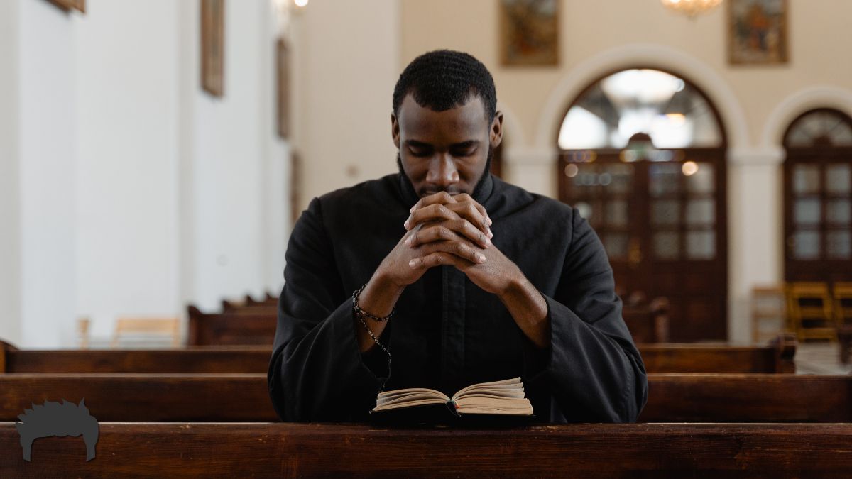 A man at church exercising his faith.